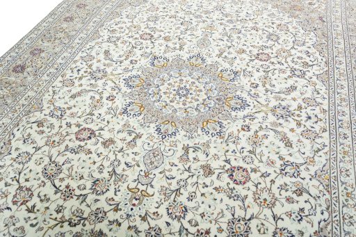 Backside of handmade 2000s Kashan rug showing knot structure and weave density