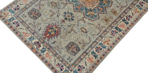 Backside of handmade New Kazak rug showing knot structure and weave density
