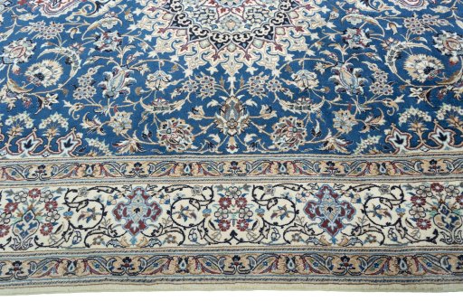 Corner detail of 2000s Nain rug showing border pattern and Wool pile