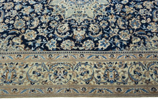 Corner detail of 2000s Nain rug showing border pattern and Wool pile
