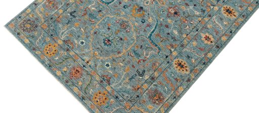 Backside of handmade New Farahan rug showing knot structure and weave density