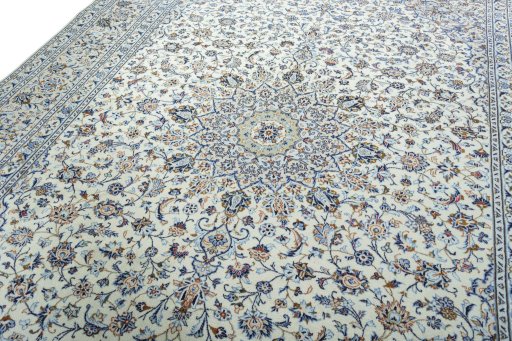 Backside of handmade 2000s Kashan rug showing knot structure and weave density