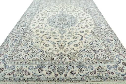 Surface texture of 2000s Nain rug with natural Wool and intricate pattern