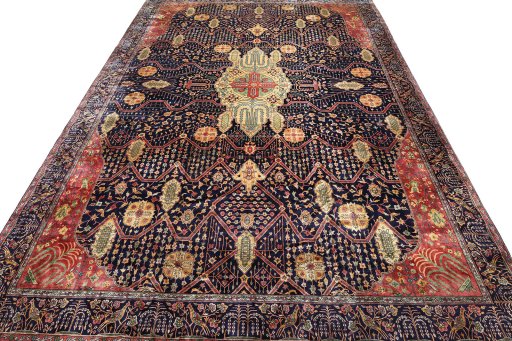 Surface texture of 1920s Agra rug with natural Wool and intricate pattern