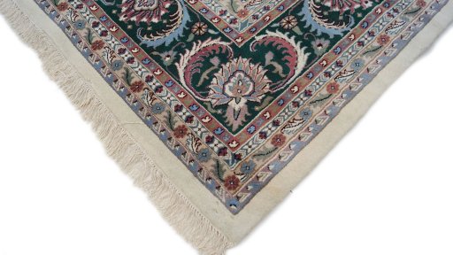 Backside of handmade New Agra rug showing knot structure and weave density