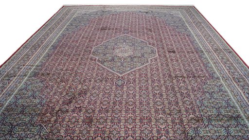 Backside of handmade 1990s Jaipur rug showing knot structure and weave density