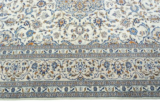 Corner detail of 2000s Kashan rug showing border pattern and Wool pile
