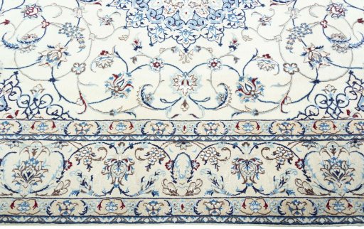 Corner detail of 2000s Nain rug showing border pattern and Wool pile