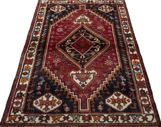 Surface texture of 2000s Shiraz rug with natural Wool and intricate pattern