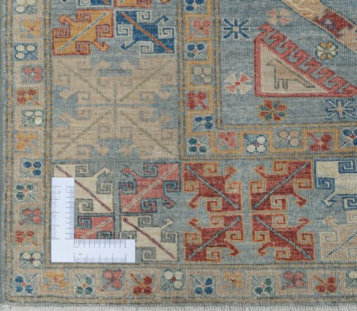 Corner detail of New Kazak rug showing border pattern and Wool pile
