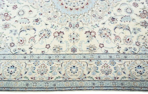Corner detail of 2000s Nain rug showing border pattern and Wool pile