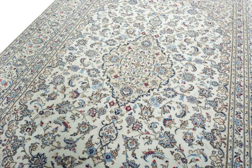 Backside of handmade 2000s Kashan rug showing knot structure and weave density