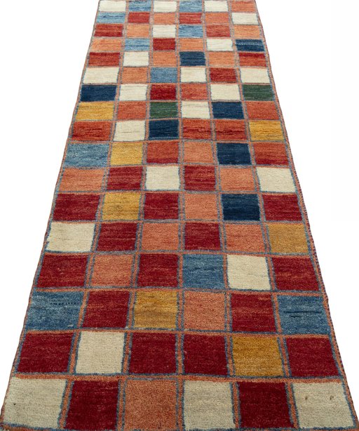 Surface texture of 2000s Persian Gabbeh rug with natural Wool and intricate pattern