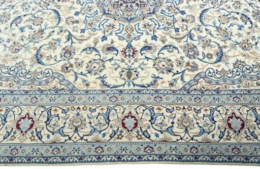 Corner detail of 2000s Nain rug showing border pattern and Wool pile