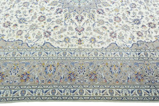 Corner detail of 2000s Kashan rug showing border pattern and Wool pile