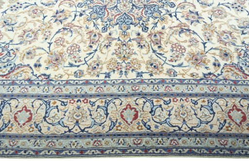Corner detail of 2000s Nain rug showing border pattern and Wool pile