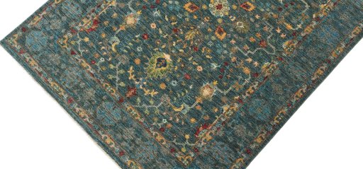 Backside of handmade New Farahan rug showing knot structure and weave density