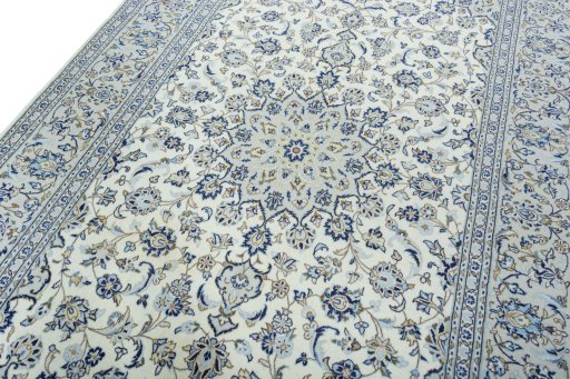 Backside of handmade 2000s Kashan rug showing knot structure and weave density