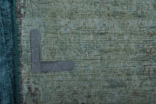 Backside of handmade 1970s Vintage rug showing knot structure and weave density