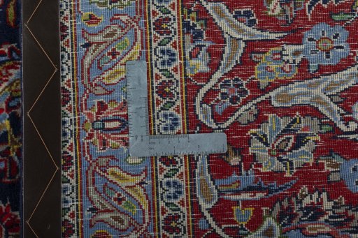 Backside of handmade New Kashan rug showing knot structure and weave density
