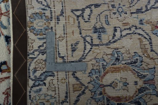 Backside of handmade 2000s Kashan rug showing knot structure and weave density