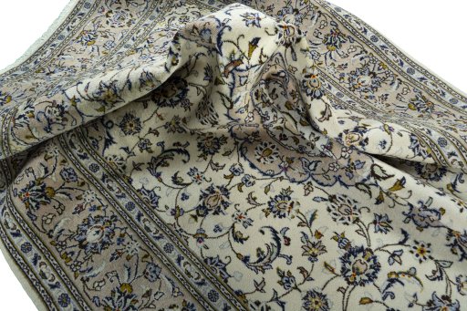 Surface texture of 2000s Kashan rug with natural Wool and intricate pattern