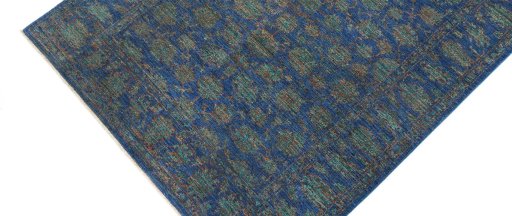 Backside of handmade New Farahan rug showing knot structure and weave density