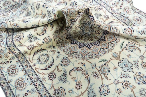 Surface texture of 2000s Nain rug with natural Wool and intricate pattern