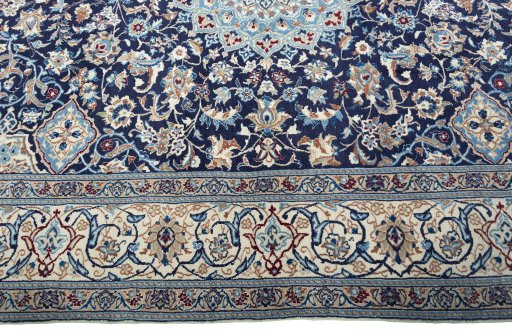 Corner detail of 2000s Nain rug showing border pattern and Wool pile
