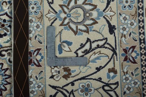 Backside of handmade 2000s Nain rug showing knot structure and weave density