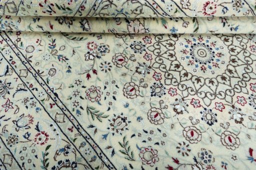 Close-up detail of 2000s Nain rug from Iran / Persia showing Wool weave