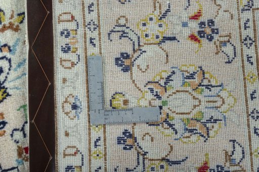 Backside of handmade New Kashan rug showing knot structure and weave density