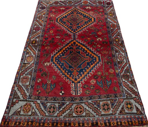 Surface texture of 2000s Shiraz rug with natural Wool and intricate pattern
