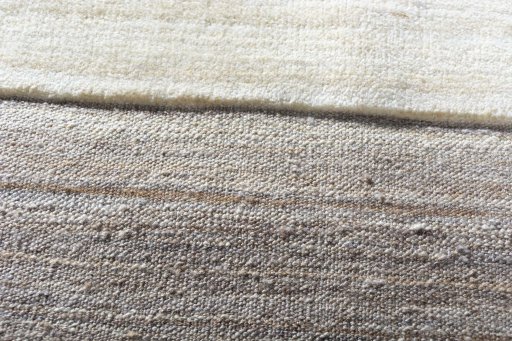 Backside of handmade New Kilim Ghashghai rug showing knot structure and weave density