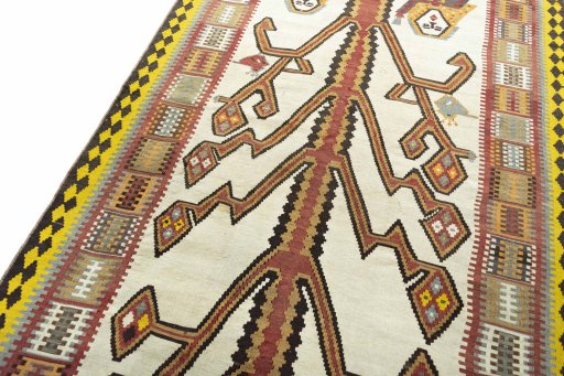 Surface texture of 2000s Kilim Ghashghai rug with natural Wool and intricate pattern