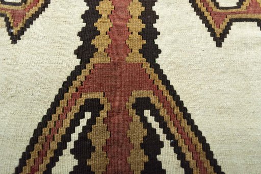 Backside of handmade 2000s Kilim Ghashghai rug showing knot structure and weave density