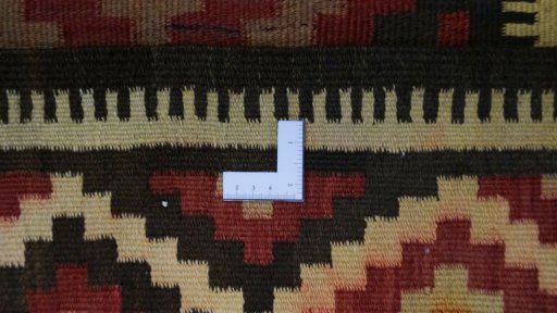 Corner detail of 1990s Kilim Traditional rug showing border pattern and Wool pile