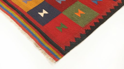 Backside of handmade New Kilim Traditional rug showing knot structure and weave density