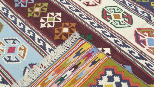 Close-up detail of New Kilim Traditional rug from Iran / Persia showing Wool weave