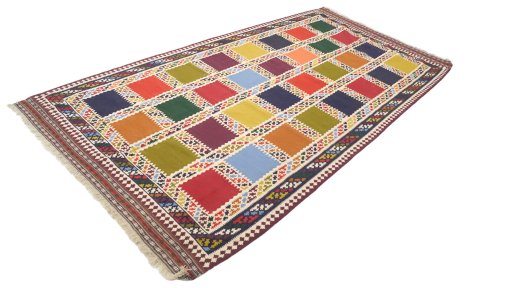 Close-up detail of New Kilim Traditional rug from Iran / Persia showing Wool weave