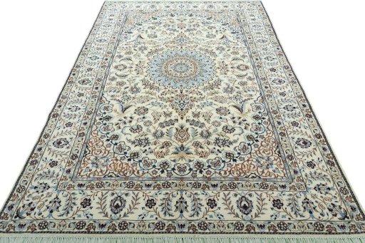 Surface texture of 2000s Nain rug with natural Wool and intricate pattern