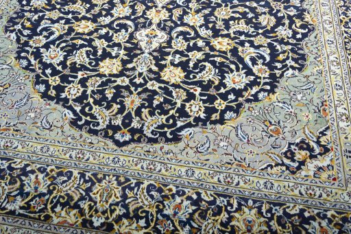 Close-up detail of 2000s Kashan rug from Iran / Persia showing Wool weave