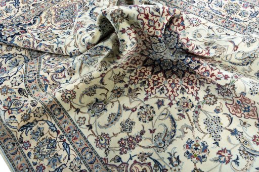 Surface texture of 2000s Nain rug with natural Wool and intricate pattern