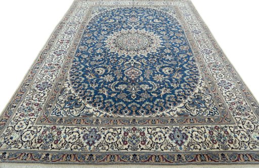 Surface texture of 2000s Nain rug with natural Wool and intricate pattern