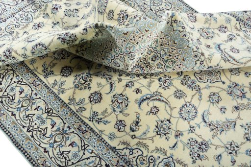 Surface texture of 2000s Nain rug with natural Wool and intricate pattern