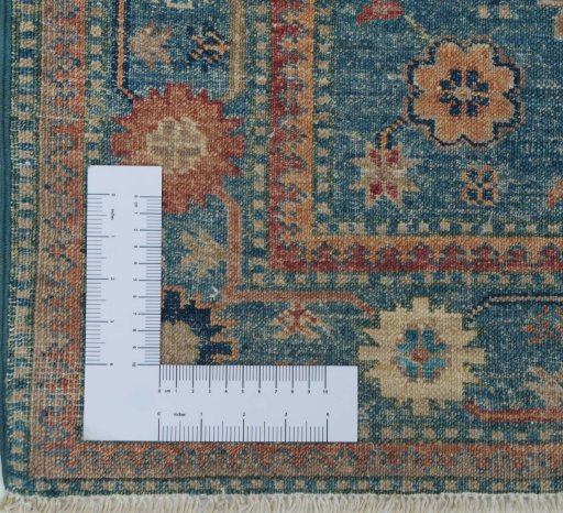 Corner detail of New Kazak rug showing border pattern and Wool pile