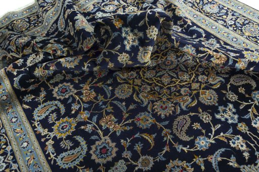 Surface texture of 2000s Kashan rug with natural Wool and intricate pattern