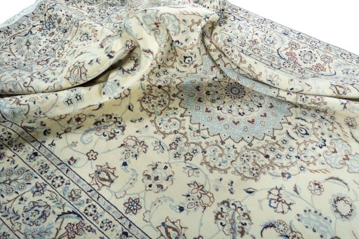 Surface texture of 2000s Nain rug with natural Wool and intricate pattern