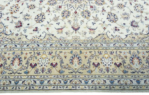 Corner detail of 2000s Kashan rug showing border pattern and Wool pile