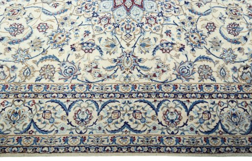Corner detail of 2000s Nain rug showing border pattern and Wool pile